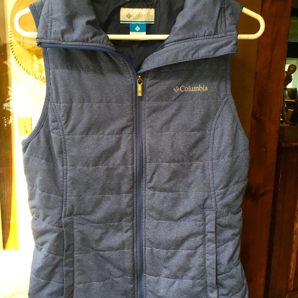 Columbia quilted blue vest. Full zip. Soft. High Collared neck. Size S.